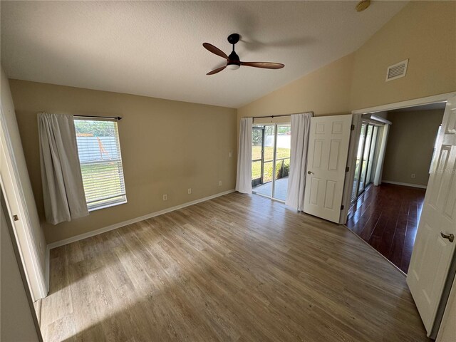 11811 53rd Ct E, Parrish, FL 34219 - spare room featuring baseboards, a textured ceiling, visible vents, a ceiling fan, and wood finished floors