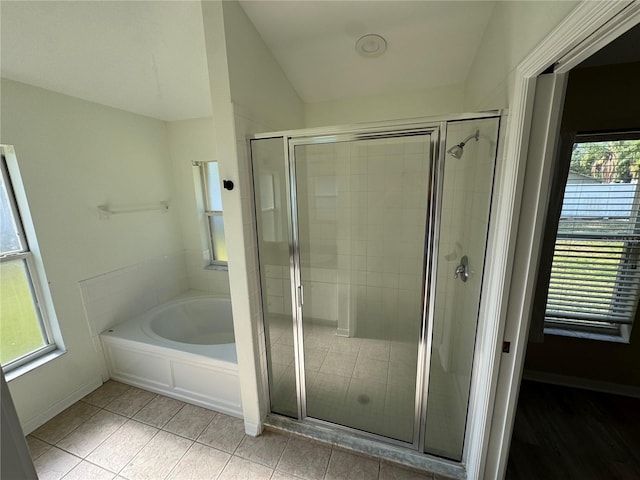 11811 53rd Ct E, Parrish, FL 34219 - full bathroom with tile patterned floors, lofted ceiling, a garden tub, and a shower stall