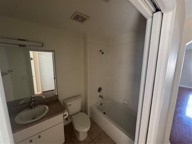 11811 53rd Ct E, Parrish, FL 34219 - full bathroom featuring tile patterned floors, toilet, vanity, shower / bathtub combination, and visible vents