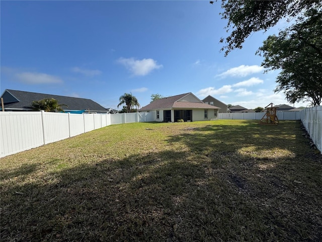 11811 53rd Ct E, Parrish, FL 34219 - view of yard featuring a fenced backyard and a playground
