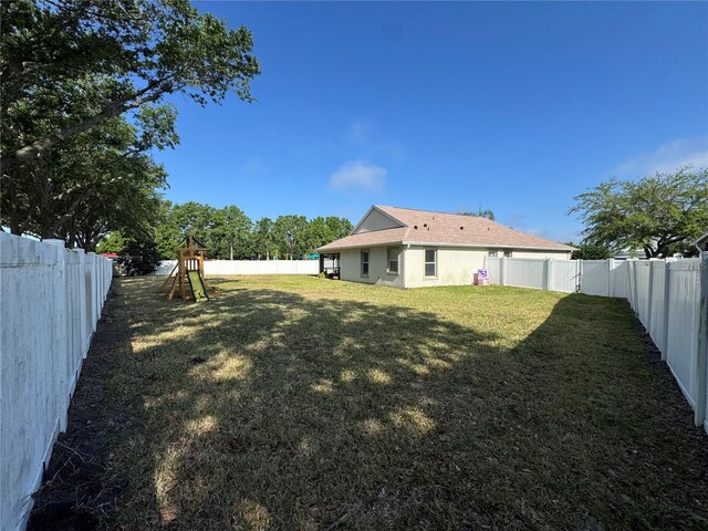 11811 53rd Ct E, Parrish, FL 34219 - view of yard with a fenced backyard and a playground