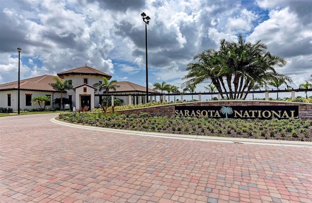 exterior space featuring curved driveway