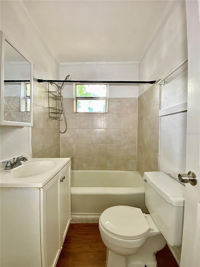 bathroom with vanity, toilet, shower / bathtub combination, and wood finished floors