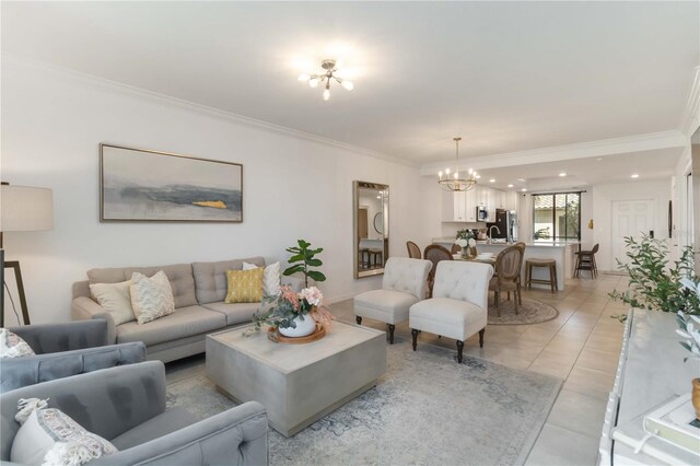 living room with recessed lighting, a notable chandelier, and crown molding
