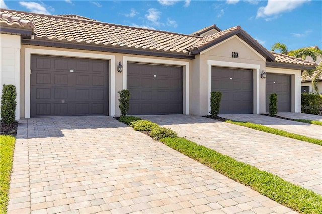 view of front of home featuring a tile roof and stucco siding