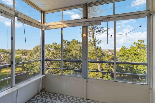 unfurnished sunroom with a wealth of natural light