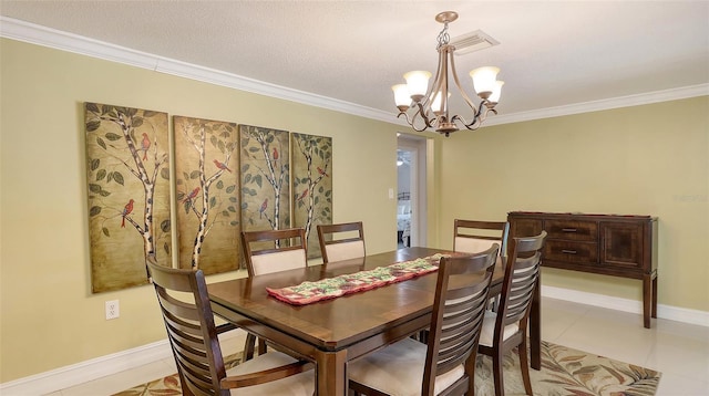 tiled dining area featuring crown molding, visible vents, an inviting chandelier, and baseboards