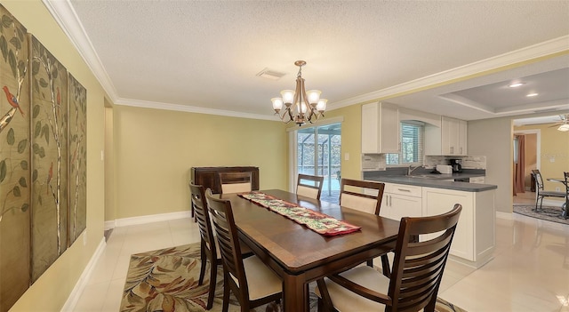 dining room with light tile patterned flooring, ornamental molding, and baseboards