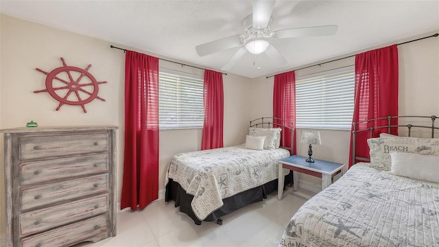 bedroom with tile patterned flooring and a ceiling fan