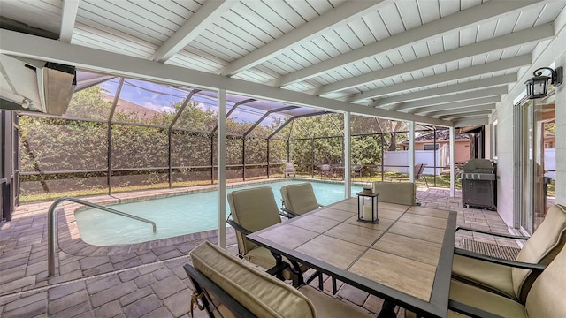 view of pool featuring a patio, a lanai, outdoor dining space, and a fenced in pool