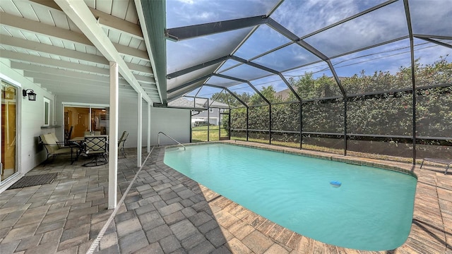 outdoor pool with a patio and a lanai