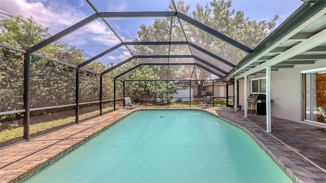 pool with a grill, glass enclosure, and a patio area