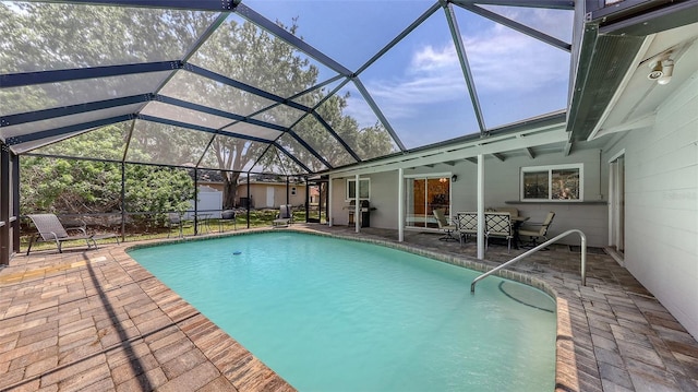 pool with a patio and glass enclosure