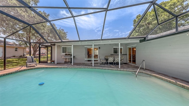 pool with a patio area and a lanai