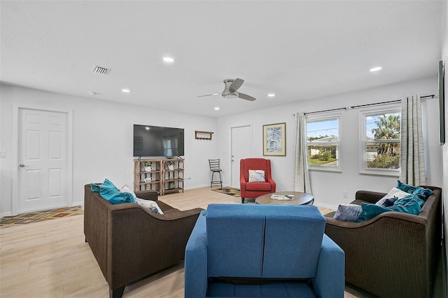 living area with recessed lighting, a ceiling fan, light wood-type flooring, and visible vents
