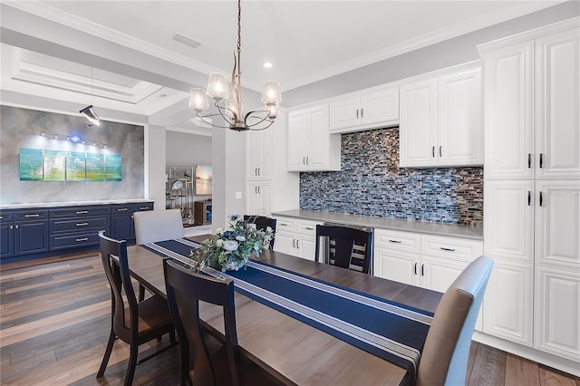 4625 Foxtail Dr, Parrish, FL 34219 - kitchen featuring blue cabinets, a chandelier, wine cooler, white cabinetry, and crown molding