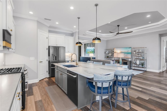 4625 Foxtail Dr, Parrish, FL 34219 - kitchen with gas stove, high end fridge, a sink, ornamental molding, and dishwasher