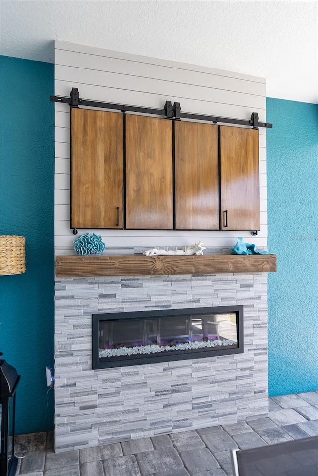 4625 Foxtail Dr, Parrish, FL 34219 - detailed view of a stone fireplace, a textured ceiling, and a textured wall
