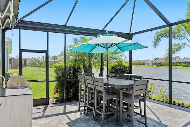 4625 Foxtail Dr, Parrish, FL 34219 - sunroom with a water view, an outdoor kitchen, outdoor dining space, and a residential view