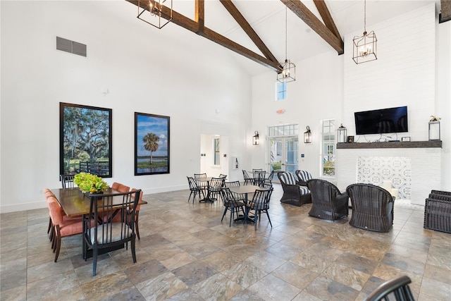 4625 Foxtail Dr, Parrish, FL 34219 - dining space featuring high vaulted ceiling, stone finish flooring, a chandelier, baseboards, and beamed ceiling