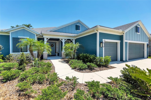 4308 Fly Rod Ter, Parrish, FL 34219 - single story home featuring an attached garage, board and batten siding, roof with shingles, and concrete driveway