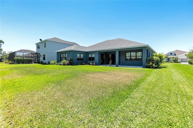 4308 Fly Rod Ter, Parrish, FL 34219 - back of house with a lawn
