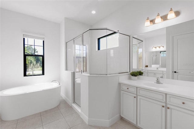 4308 Fly Rod Ter, Parrish, FL 34219 - bathroom with a freestanding bath, vanity, tile patterned floors, baseboards, and a stall shower
