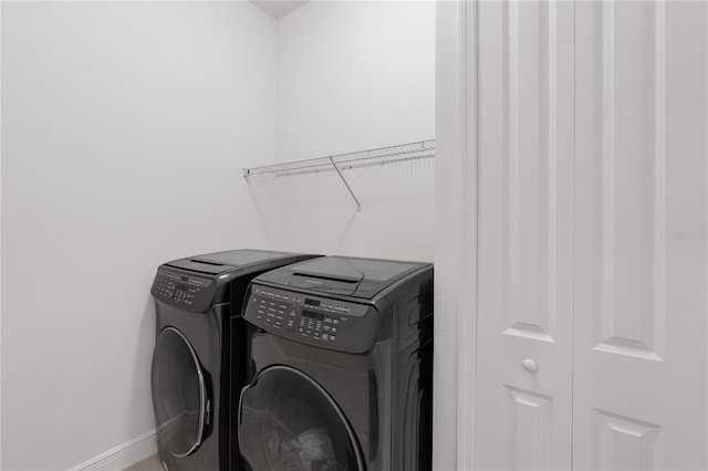 4308 Fly Rod Ter, Parrish, FL 34219 - laundry room with baseboards, laundry area, and independent washer and dryer