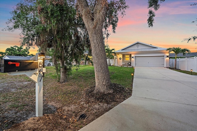 867 Bacon Ave, Sarasota, FL 34232 - ranch-style house featuring fence, an attached garage, driveway, and a front yard