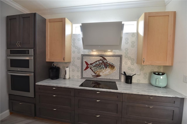 17817 Woodland Ct, Punta Gorda, FL 33982 - kitchen with double oven, ornamental molding, and black electric stovetop