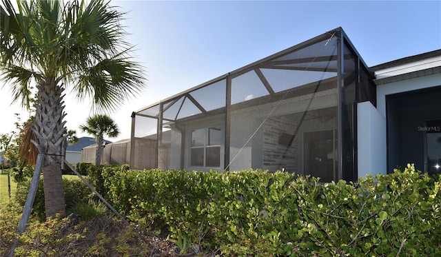 17817 Woodland Ct, Punta Gorda, FL 33982 - view of side of home featuring glass enclosure
