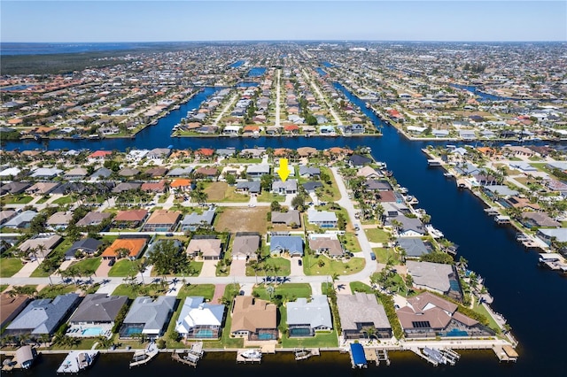 aerial view featuring a residential view and a water view