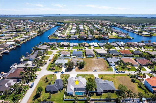 bird's eye view featuring a residential view and a water view