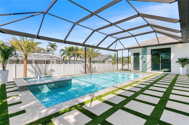 view of swimming pool with a lanai, fence, a fenced in pool, an in ground hot tub, and a patio area