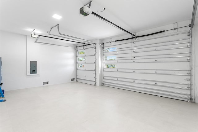 garage featuring a garage door opener and electric panel
