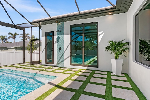 view of pool featuring fence, a lanai, a patio, and a fenced in pool