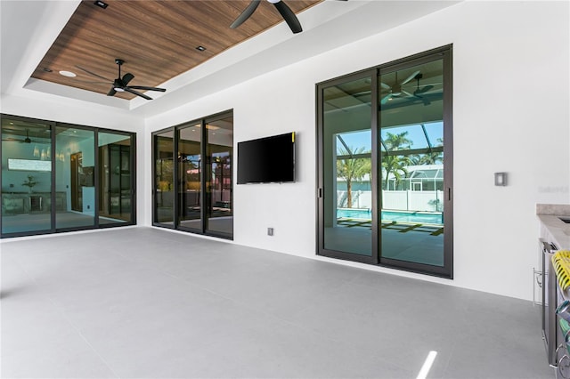 view of patio featuring ceiling fan