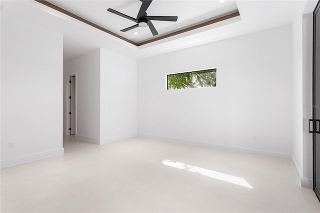 unfurnished room with a tray ceiling, baseboards, ceiling fan, and recessed lighting