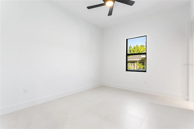 unfurnished room with baseboards and a ceiling fan
