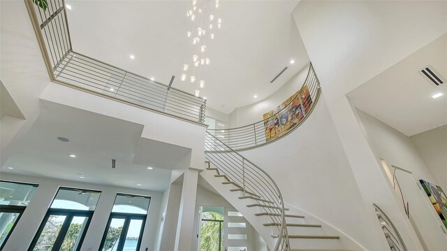 1540 Hillview Dr, Sarasota, FL 34239 - staircase with a towering ceiling, visible vents, and a healthy amount of sunlight