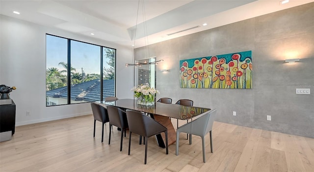 1540 Hillview Dr, Sarasota, FL 34239 - dining space featuring a raised ceiling, wood finished floors, baseboards, visible vents, and recessed lighting