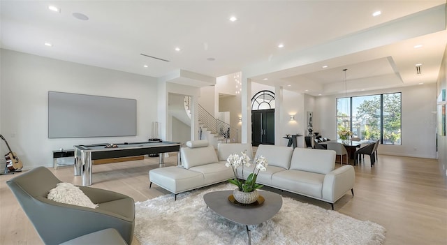 1540 Hillview Dr, Sarasota, FL 34239 - living area featuring recessed lighting, light wood-style flooring, stairway, and a raised ceiling
