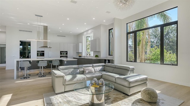 1540 Hillview Dr, Sarasota, FL 34239 - living room with baseboards, recessed lighting, light wood-style floors, and plenty of natural light
