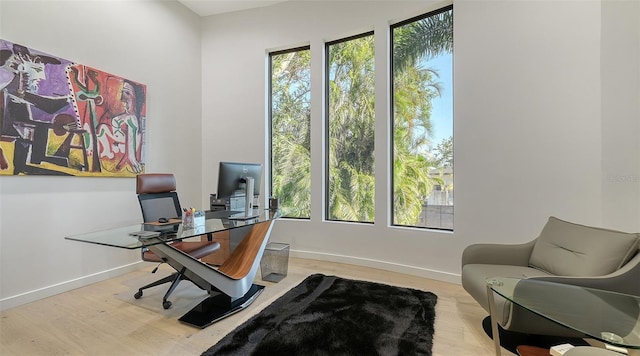 1540 Hillview Dr, Sarasota, FL 34239 - home office featuring baseboards and wood finished floors
