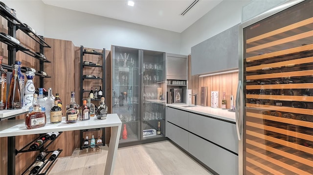 1540 Hillview Dr, Sarasota, FL 34239 - wine area with light wood-style flooring and wine cooler