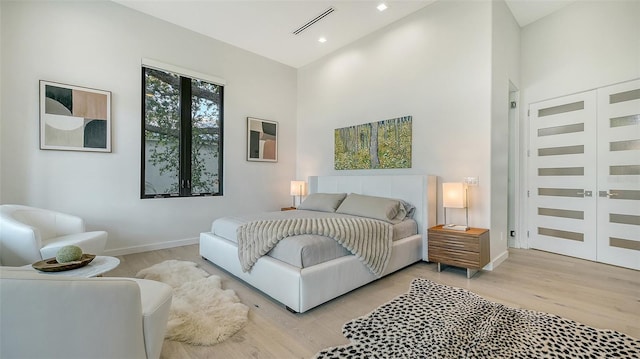 1540 Hillview Dr, Sarasota, FL 34239 - bedroom with baseboards, visible vents, and light wood finished floors