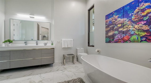 1540 Hillview Dr, Sarasota, FL 34239 - bathroom with baseboards, marble finish floor, a freestanding tub, and vanity