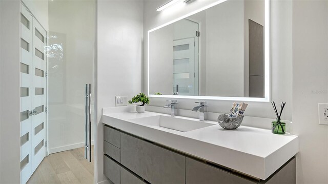 1540 Hillview Dr, Sarasota, FL 34239 - bathroom with vanity and wood finished floors