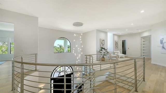 1540 Hillview Dr, Sarasota, FL 34239 - interior space with baseboards, an upstairs landing, light wood-style flooring, and a wealth of natural light