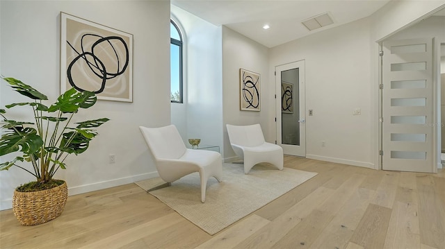 1540 Hillview Dr, Sarasota, FL 34239 - sitting room featuring visible vents, baseboards, and light wood-type flooring